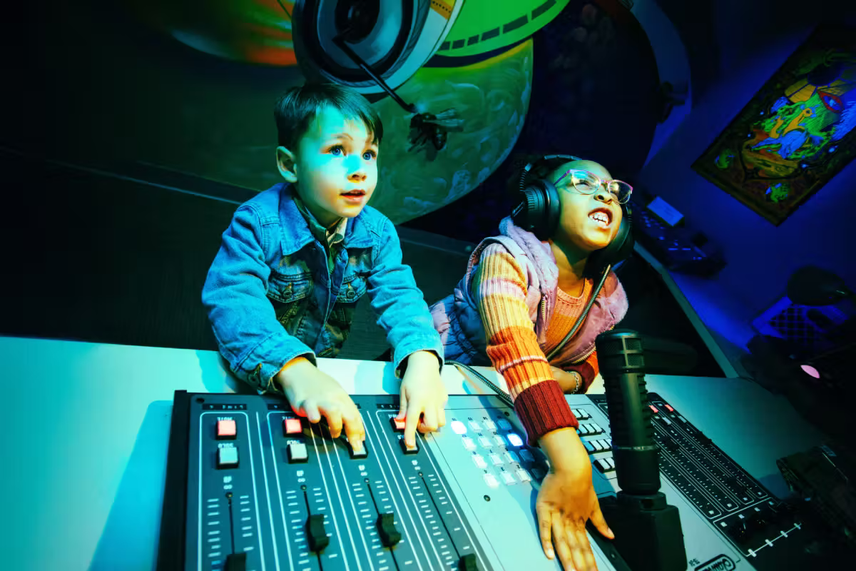 two kids playing with dials inside Meow Wolf Houston