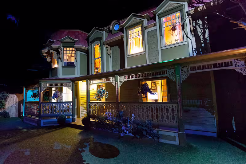 a seemingly normal house with lights coming from within